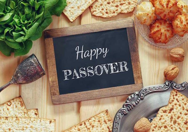 Table with seasonal fare and Happy Passover sign