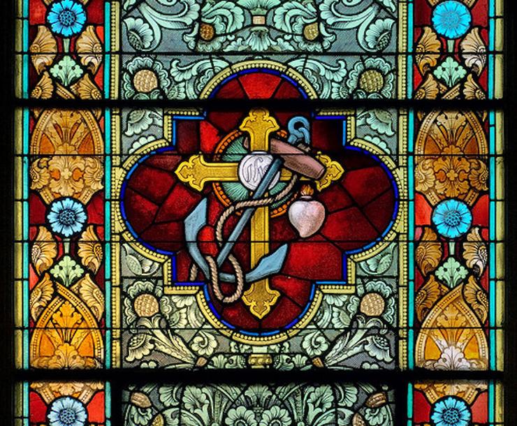 Saint Peter Roman Catholic Church, in Saint Charles, Missouri, USA - stained glass window of cross and anchor