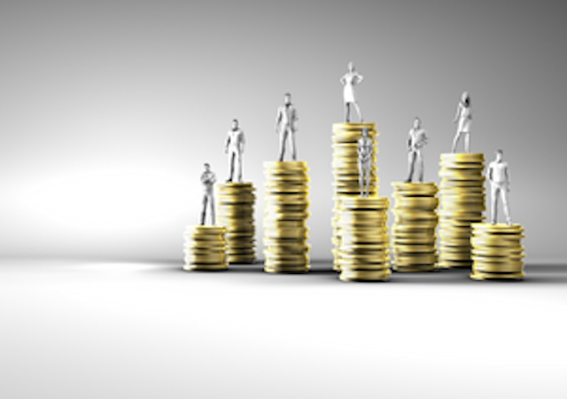 People standing on stacked coins