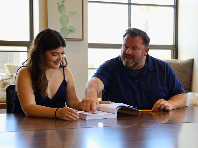 Jonathan Bowman works with a student in the Honors Lounge