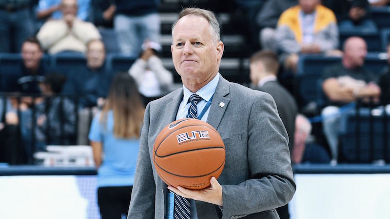 Bill McGillis holding a basketball