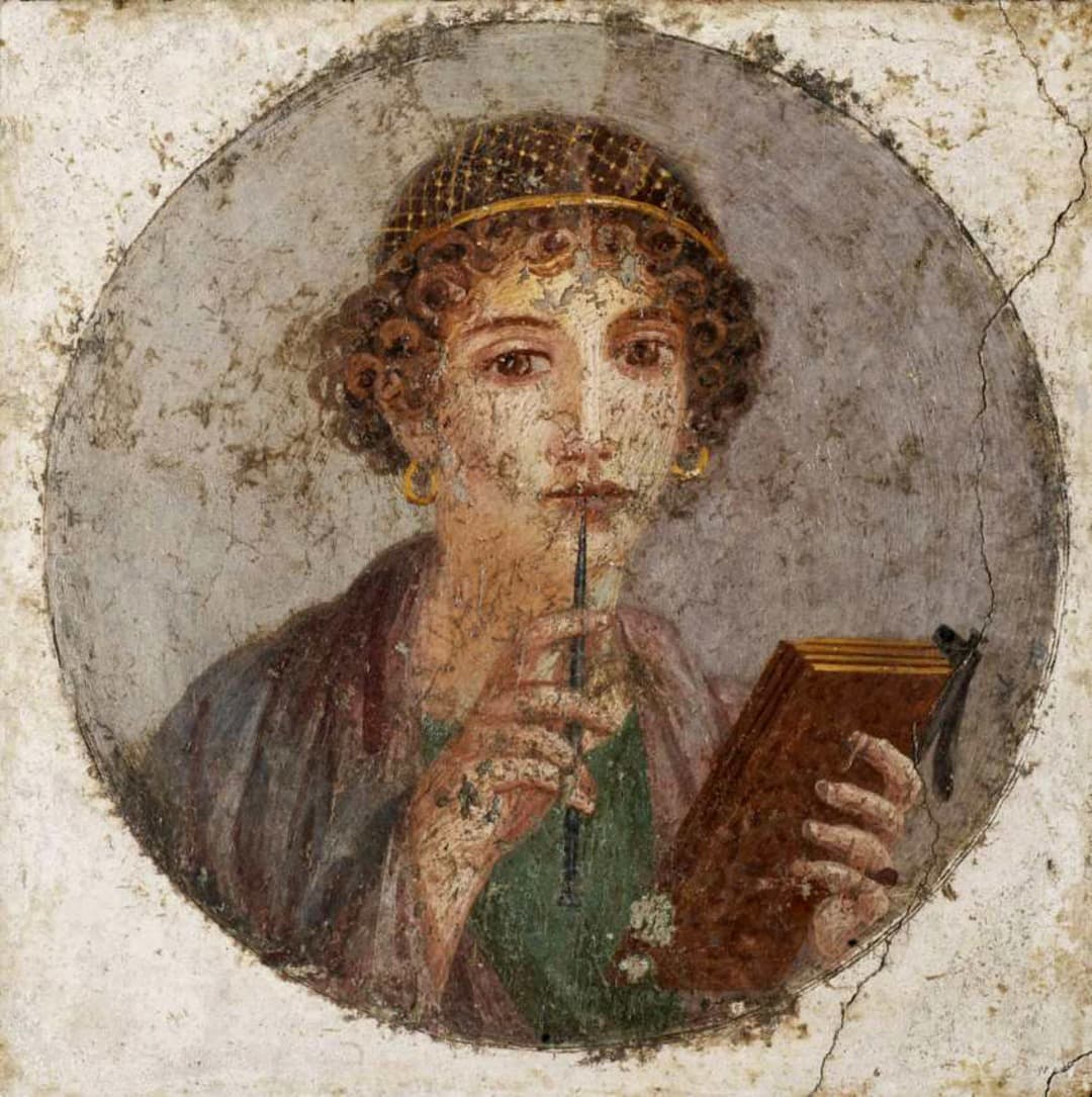 Mural painting of Sappho holding a pen and notebook