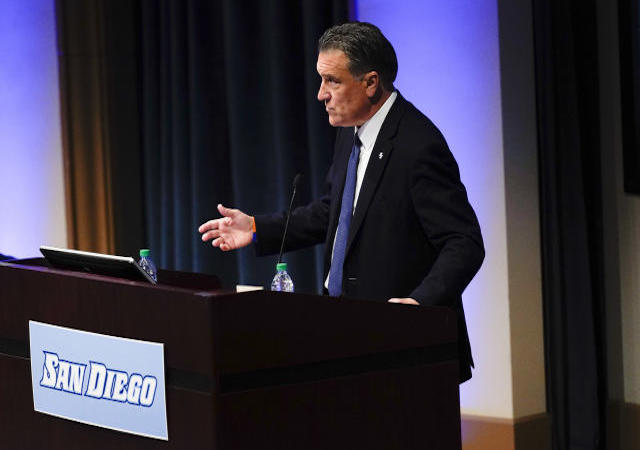 Steve Lavin at a podium during introductory press conference