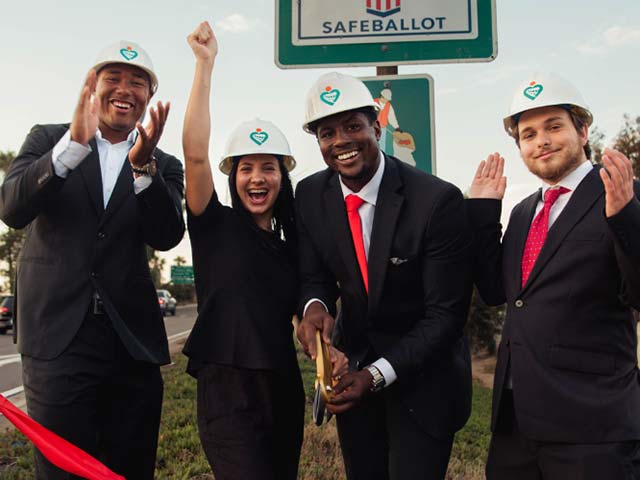 From left to right: Cordano Russell, Donatella Johnson, Elijah Johnson, and Thomas Salazar cut a red ribbon in celebration of adopting a highway.